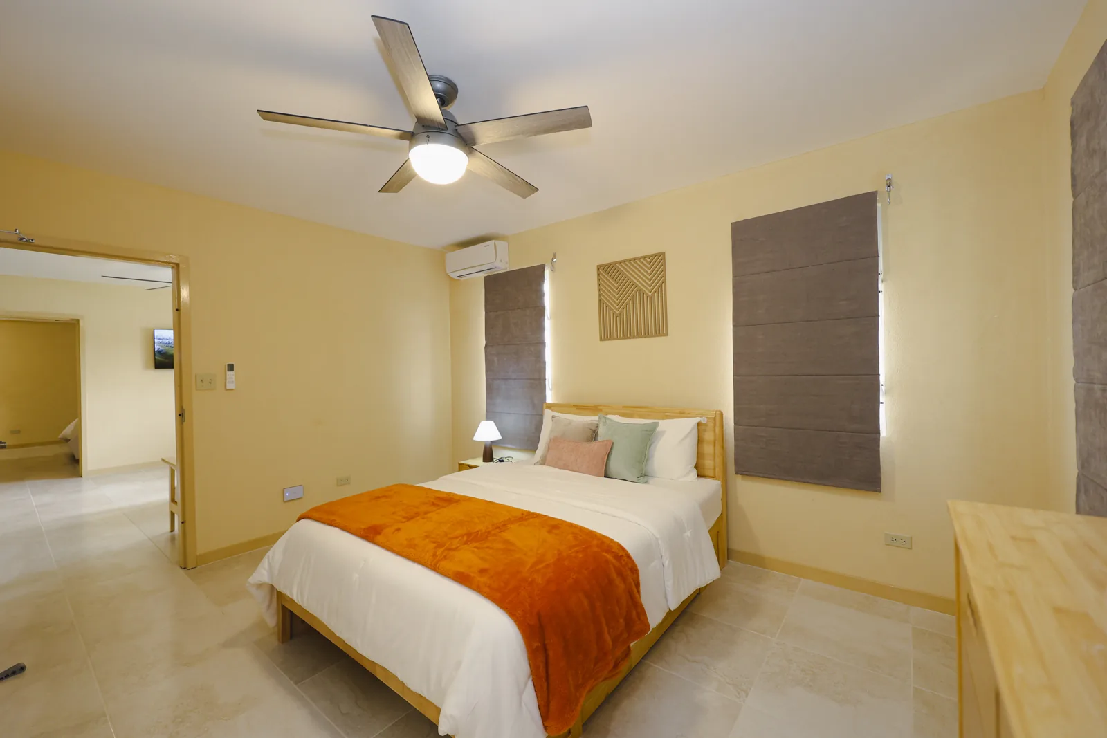 Furnished bedroom with ceiling fan