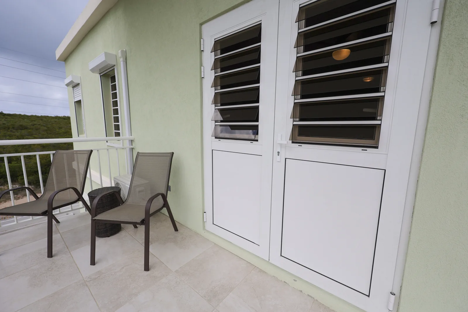 Outdoor seating by a suite entrance